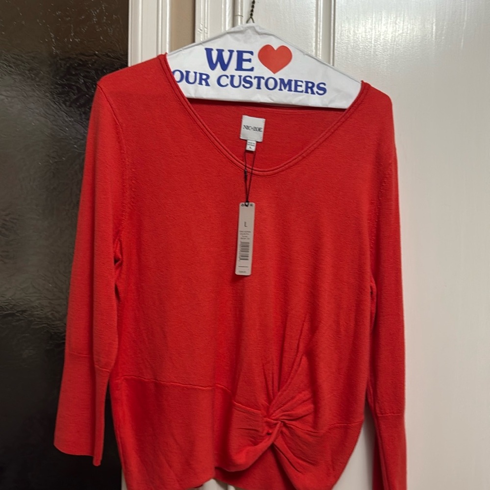 Salmon color long sleeve sweater.